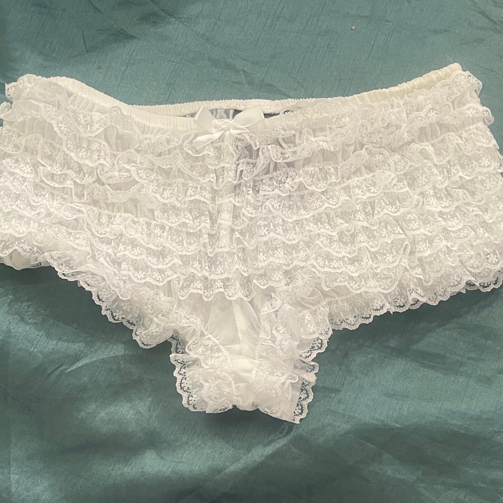 Woman’s small white ruffled panties  adorable and sexy